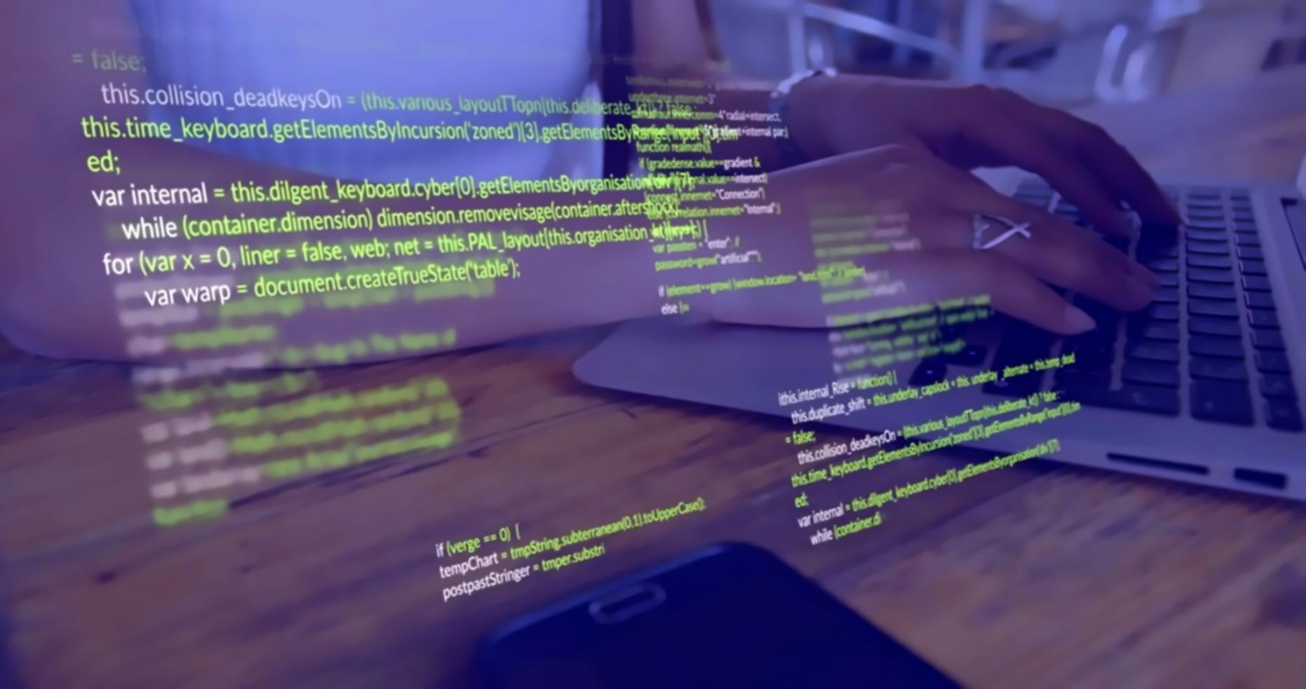 Developer working at a computer in a focused environment